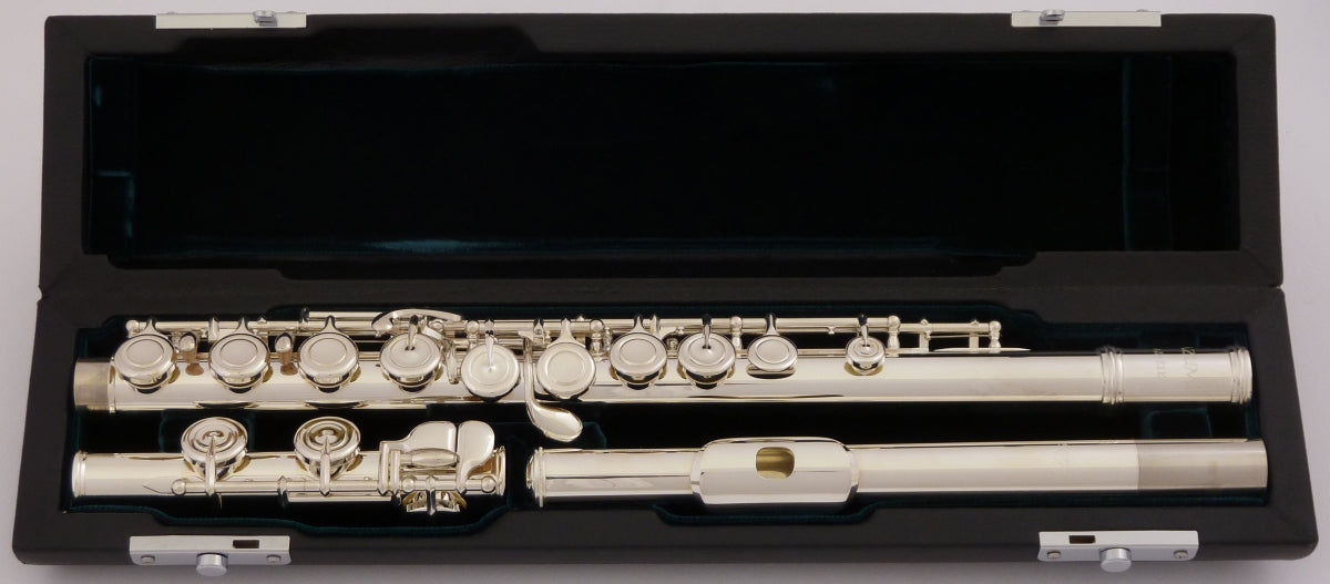 Azumi AZ1 flute displayed in an open case with a green velvet interior, revealing the silver body, headjoint and closed hole keywork