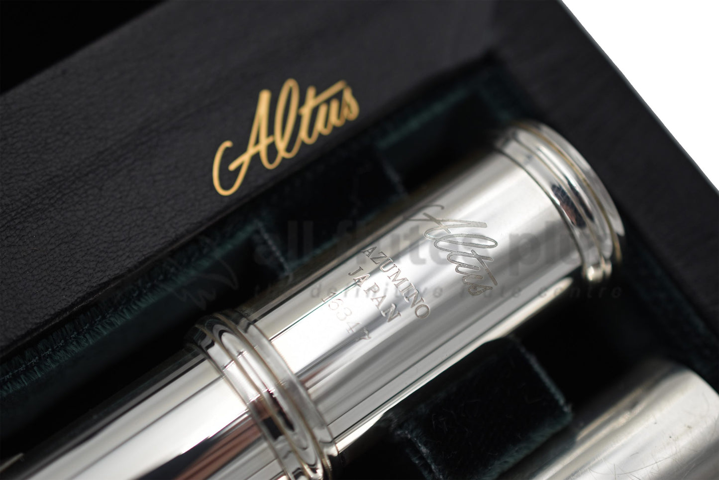 Altus A12 Flute set in an open case, close up of Altus logo on body joint 