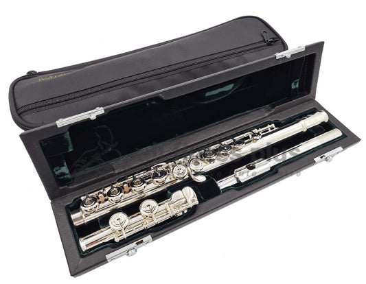 Azumi AZ1 flute displayed in an open case with a green velvet interior, revealing the silver body, headjoint, and mechanism, set in front of the black soft case cover included 