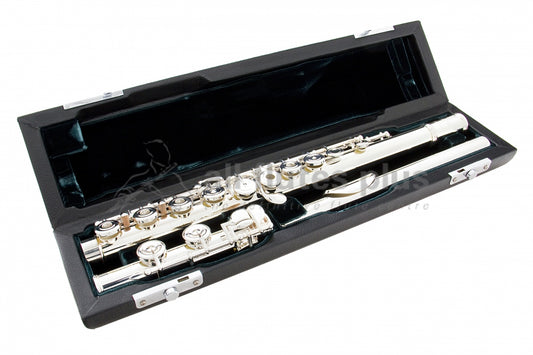 Azumi AZ2 flute displayed in an open case with green velvet interior, revealing the silver body, headjoint, and mechanism