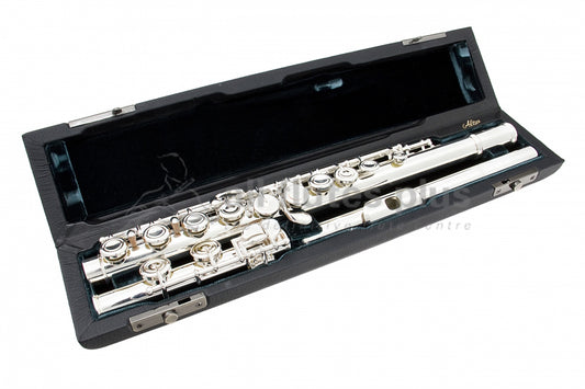 Azumi AZ3E flute displayed in an open case with a green velvet interior, revealing the silver body, headjoint, and mechanism