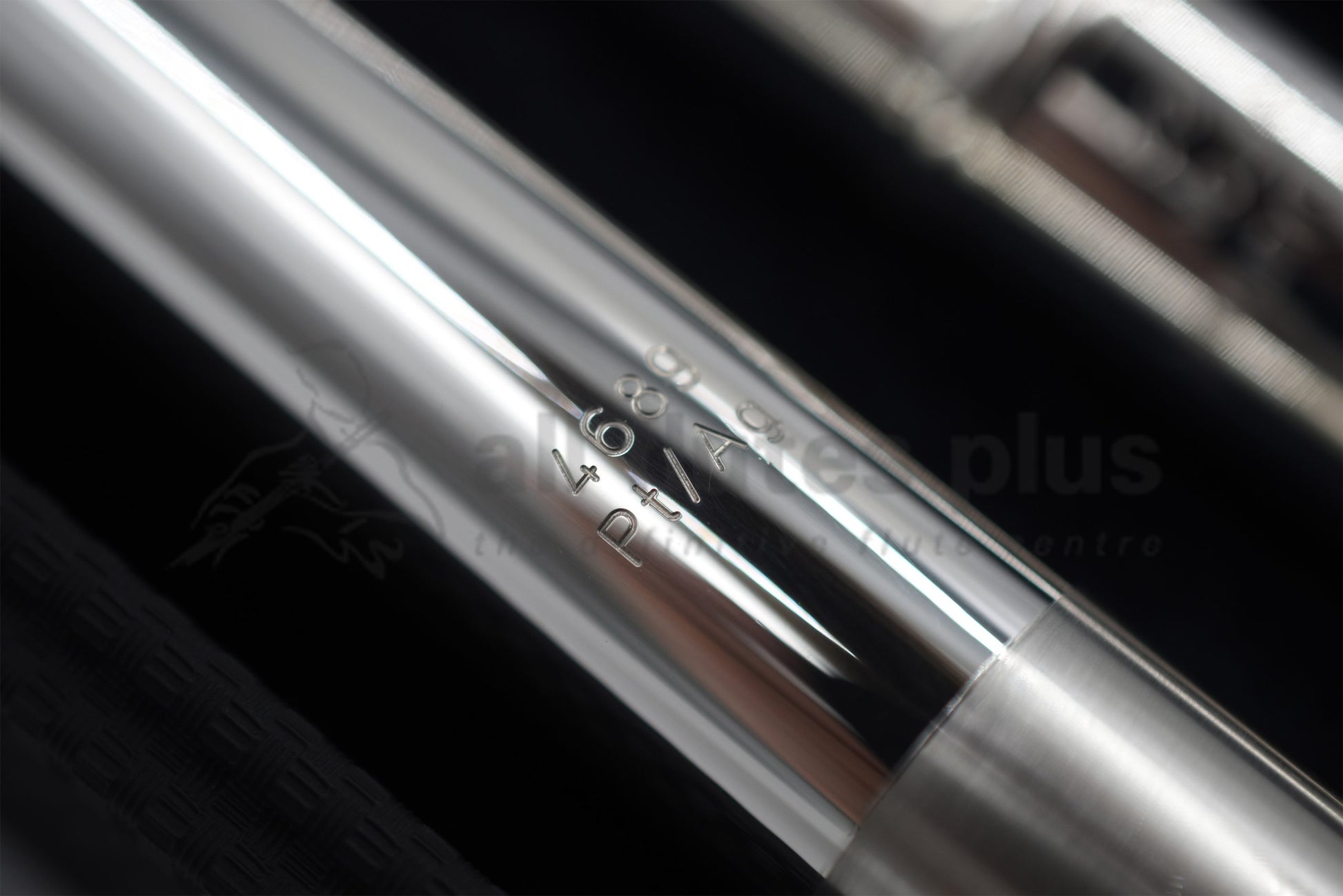 Burkart silver flute close up of silver and platinum marking on headjoint Pt/Ag, alongside the serial number 