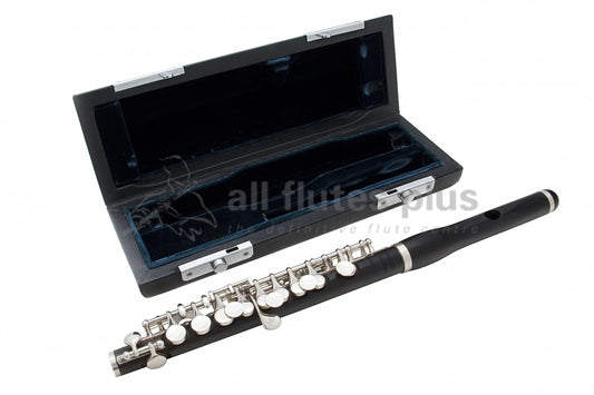 Burkart Resona Piccolo displayed in front of its empty case with green lining 