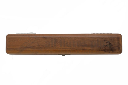 Wooden case with engraved design on a white background