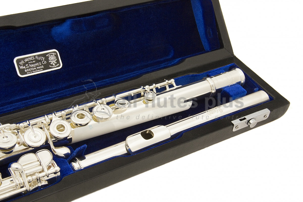 Haynes Q2RE Flute displayed in its open case with blue interior, close up of the headjoint and some body joint keywork and mechanism 