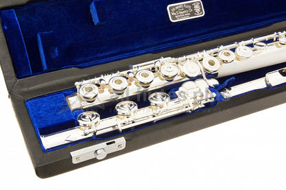 Haynes Q2RE Flute displayed in its open case with blue interior, close up of the B footjoint and body joint open hole keywork of the flute