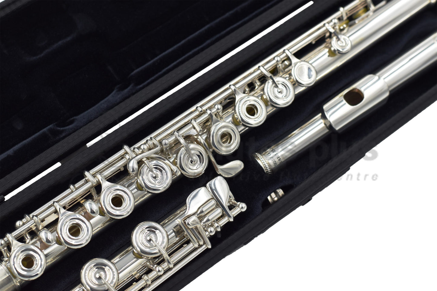 Burkart Elite flute set in an open case, close up of footjoint and body joint mechanism and keywork, and headjoint 