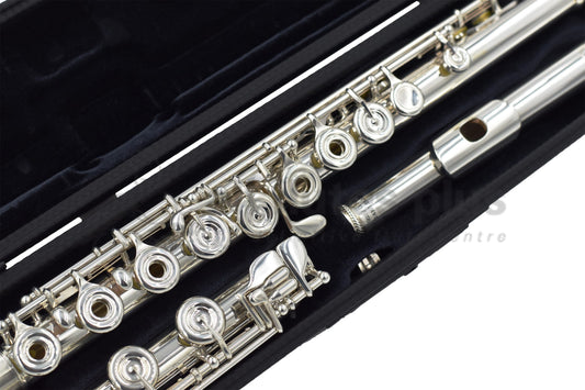 Burkart Elite flute set in an open case, close up of footjoint and body joint mechanism and keywork, and headjoint 