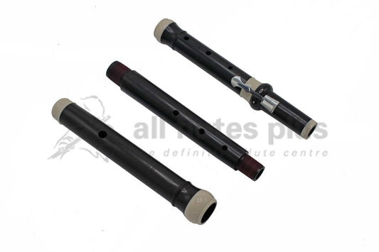 Wooden baroque flute in three parts laid out next to one another