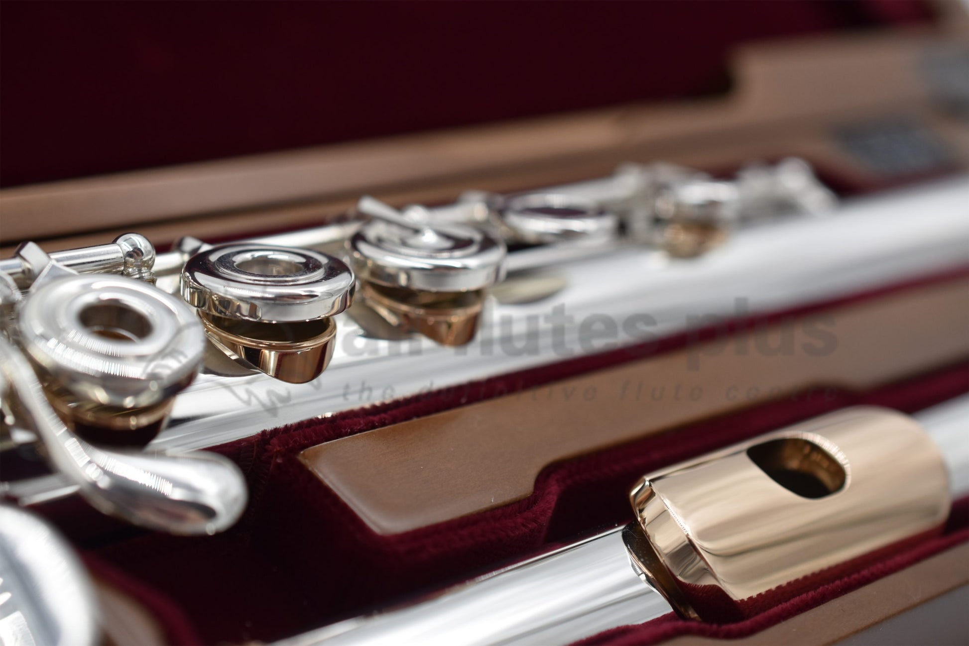 Close up of headjoint and left hand mechanism of Miyazawa CS - B Flute showing the 14K gold lip plate, riser and tone holes.