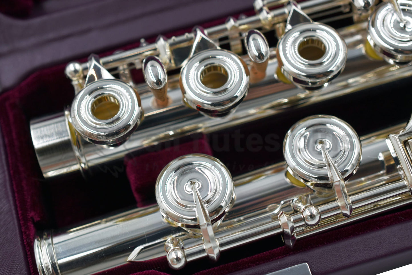 Miyazawa MJ25 flute inside a burgundy velvet lined hard case showing the c foot joint and right hand mechanism