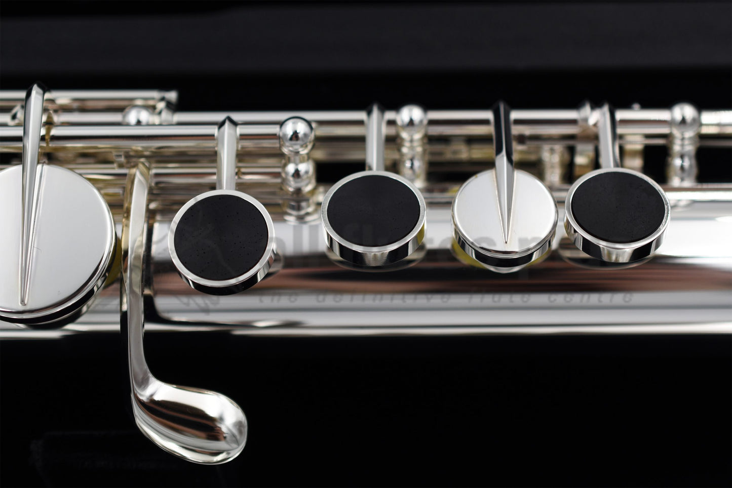 Close up of Miyazawa ST Alto flute left hand mechanism specifically the grenadilla wood touch pieces