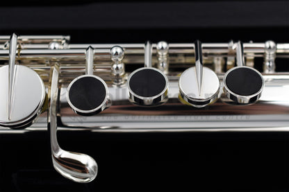 Close up of Miyazawa ST Alto flute left hand mechanism specifically the grenadilla wood touch pieces