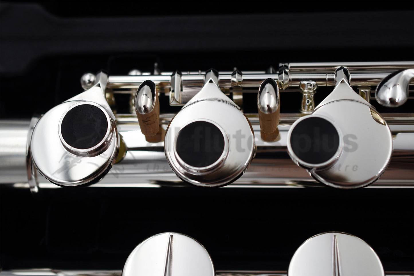 Close up of Miyazawa ST Alto flute right hand mechanism specifically the grenadilla wood touch pieces