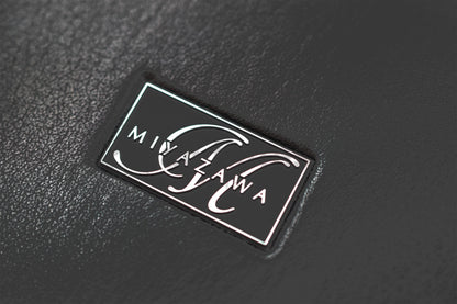 Close up of Miyazawa logo on Miyazawa Faux Leather bound hard case
