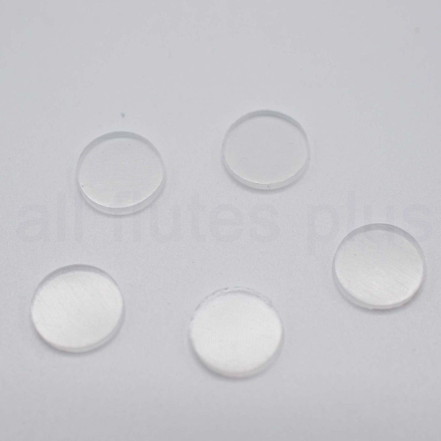 Five clear circular objects on a gray background Plugs for Miyazawa Open Hole Flutes