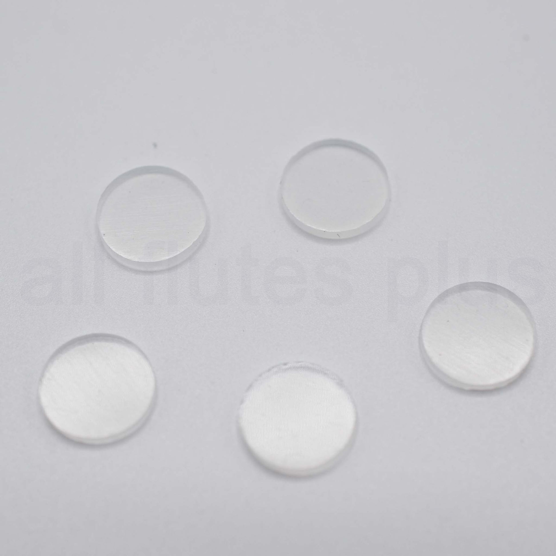 Five clear circular objects on a gray background Plugs for Miyazawa Open Hole Flutes