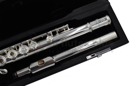 Nagahara silver flute close up of headjoint and left hand of body tube with Nagahara engraving, set inside the flute case 