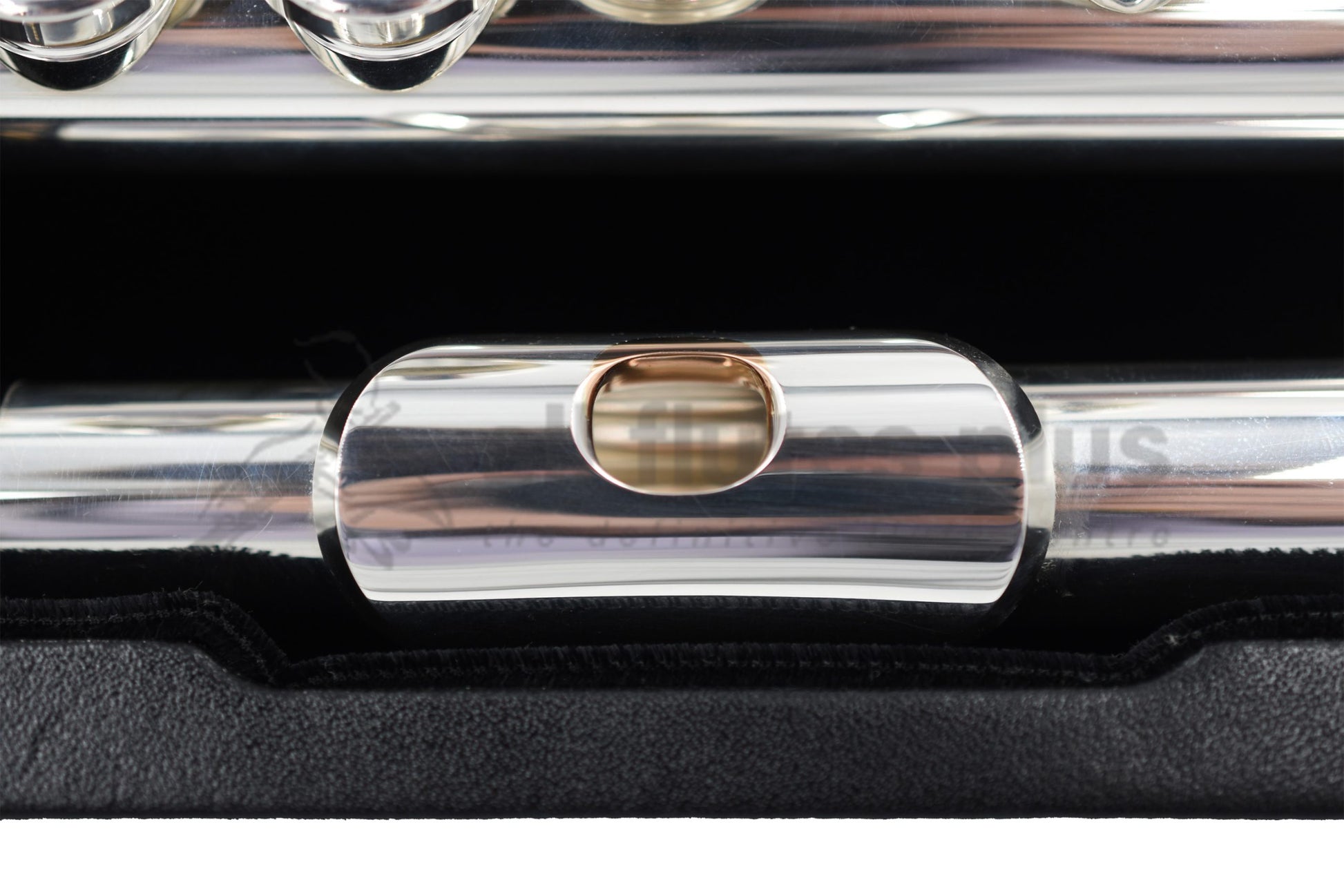 Close up of 14K gold riser on Nagahara flute headjoint set inside the flute case