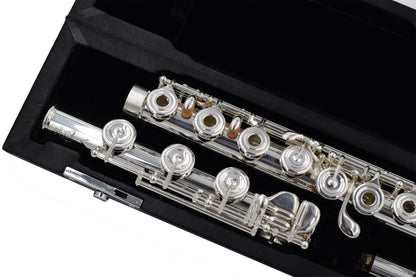 Close up of right hand body tube and mechanism and B footjoint of Nagahara silver flute, set in the flute case 