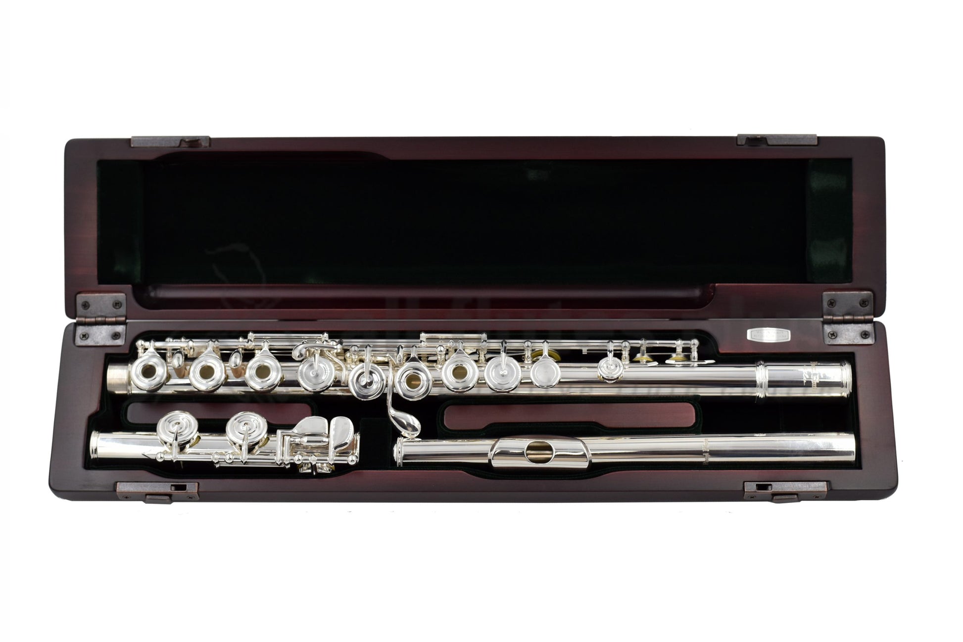 Pearl PF695RE Flute laid out in its open case, silver-plated body, and French-style pointed key-arms, displayed in a cherrywood case.