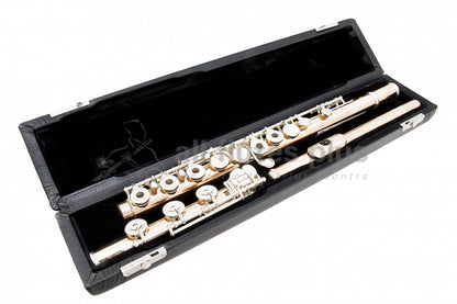 Powell handmade conservatory 9k aurumite flute displayed in its open flute case 