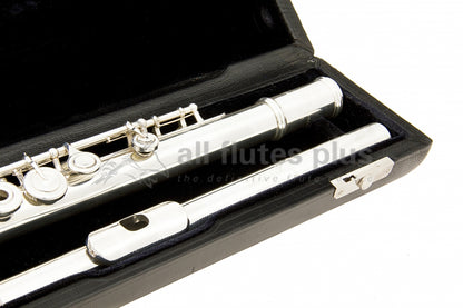 Powell Signature flute close up of headjoint, some left hand body tube and keywork, displayed in its open flute case