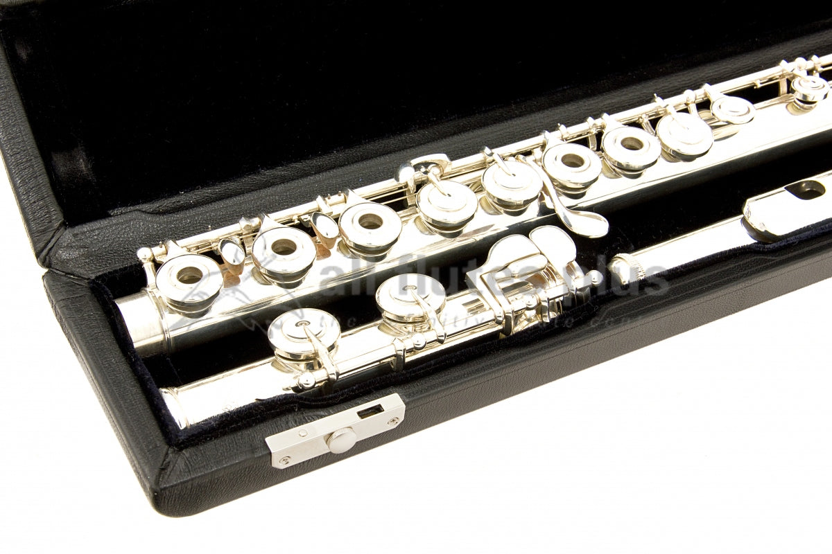 Powell Signature flute close up of right hand open hole keywork, body tube and footjoint mechanism, displayed in its open flute case  