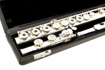 Powell Signature flute close up of right hand open hole keywork, body tube and footjoint mechanism, displayed in its open flute case  