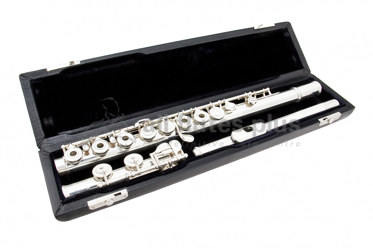 Powell Signature C foot flute displayed in its open flute case with black interior