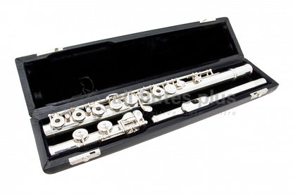 Powell Signature C foot flute displayed in its open flute case with black interior