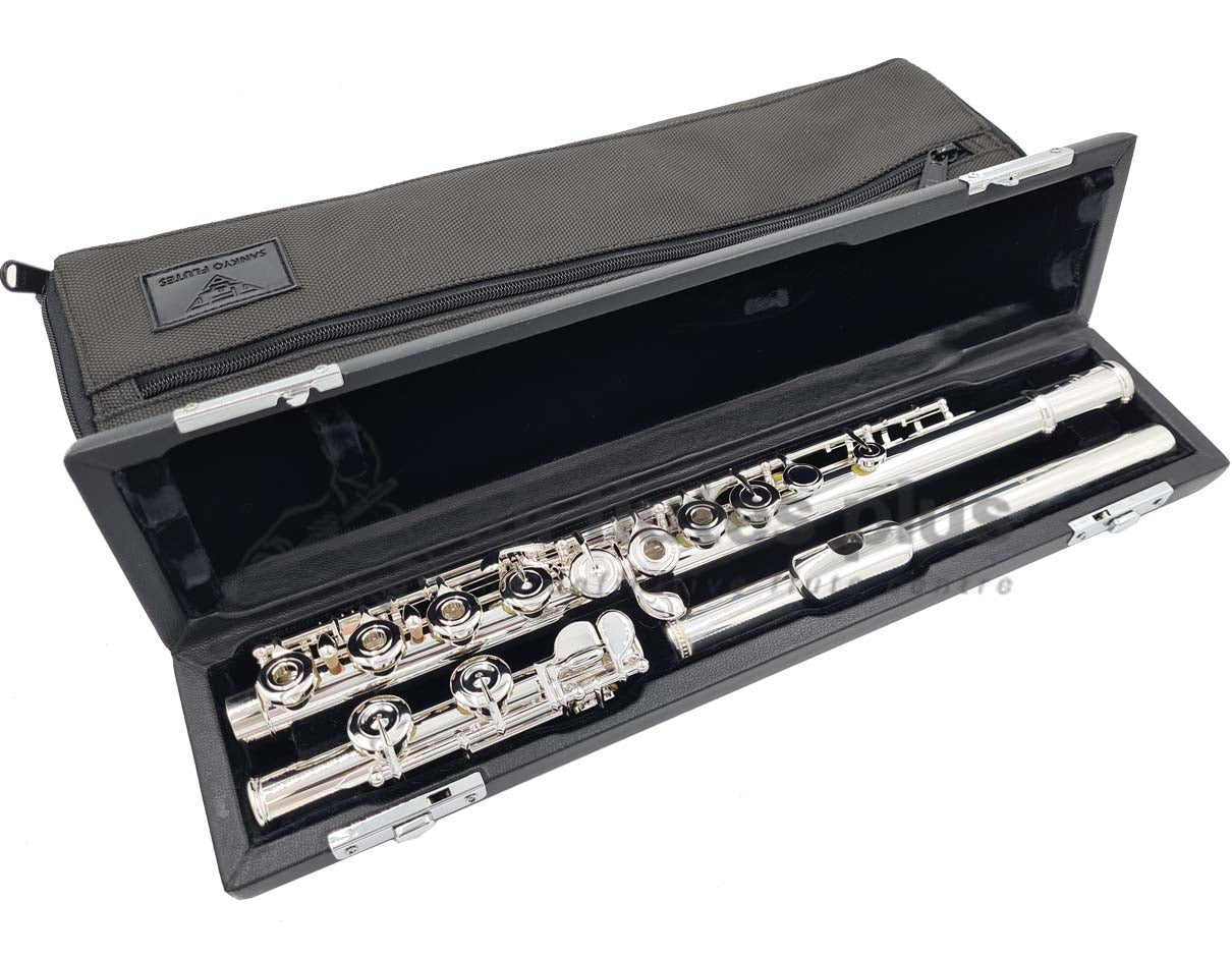 Sankyo CF201 flute displayed in its open flute case woth black velvet interior and black soft case cover behind