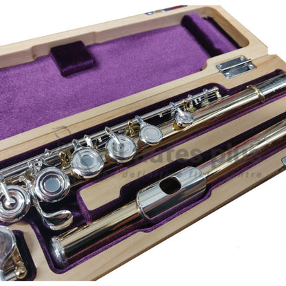 Trevor James copper body flute with silver lip and riser, displayed in an open case with purple lining.