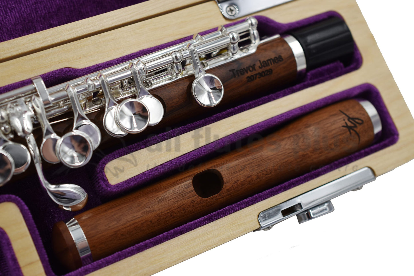 Trevor James Mopane Wood Piccolo close up of headjoint, left hand body tube and keywork, displayed in its open flute case