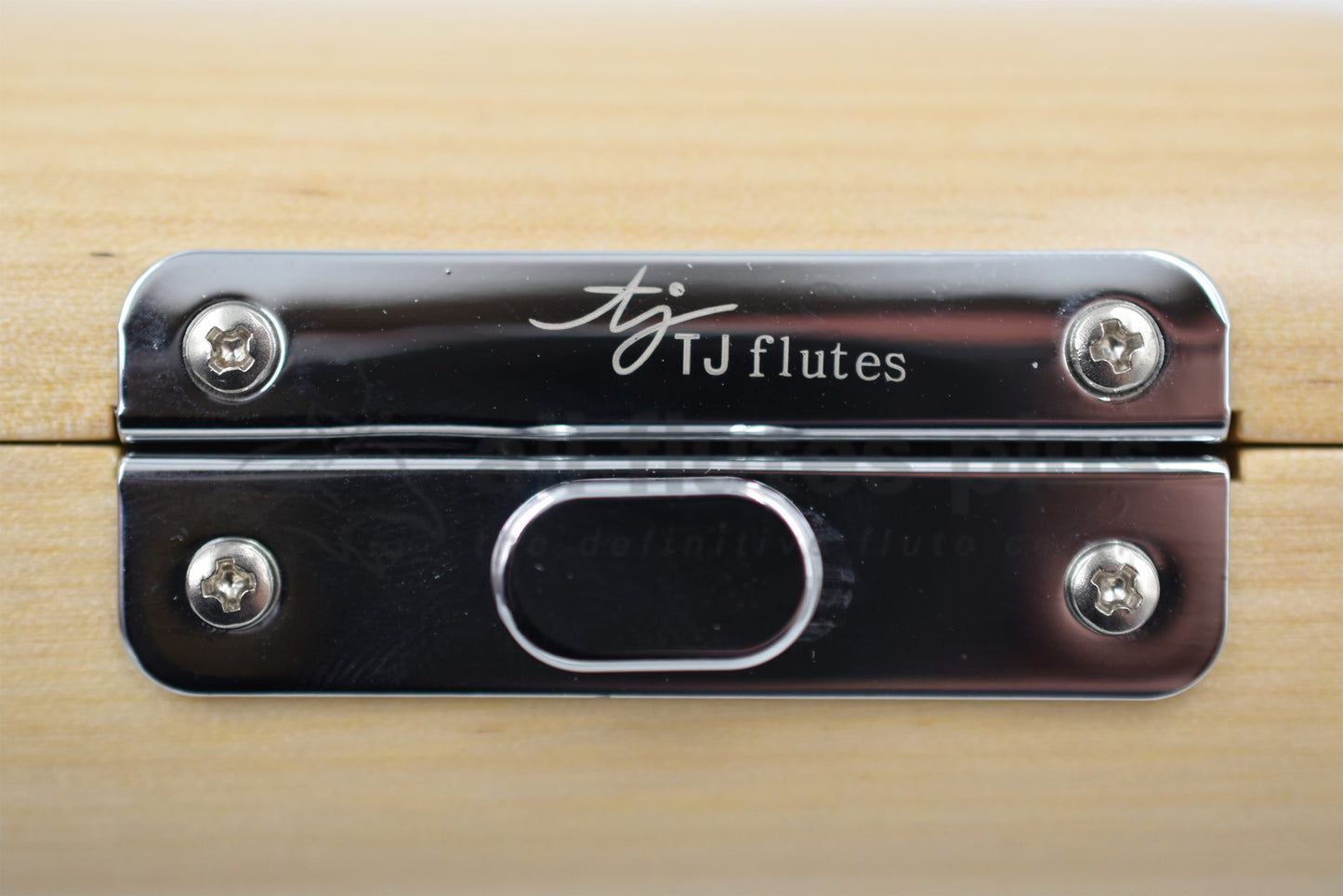 Close up of TJ Flutes logo on piccolo hard case latch