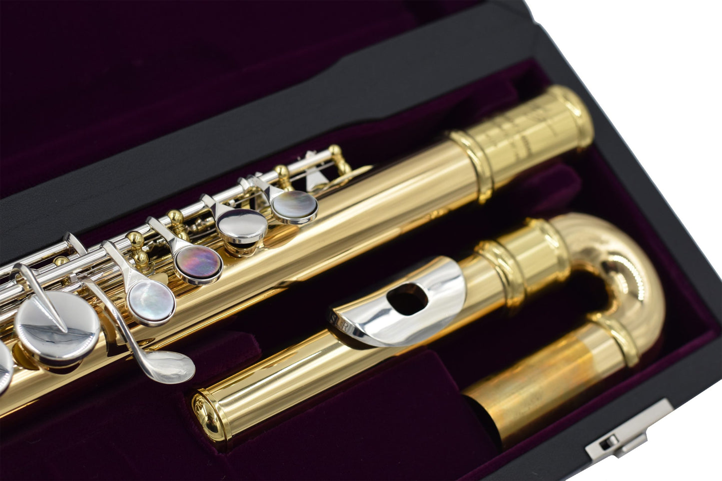 Trevor James Performers Copper Alto flute close up of curved headjoint, left hand body tube and keywork, displayed in its open flute case