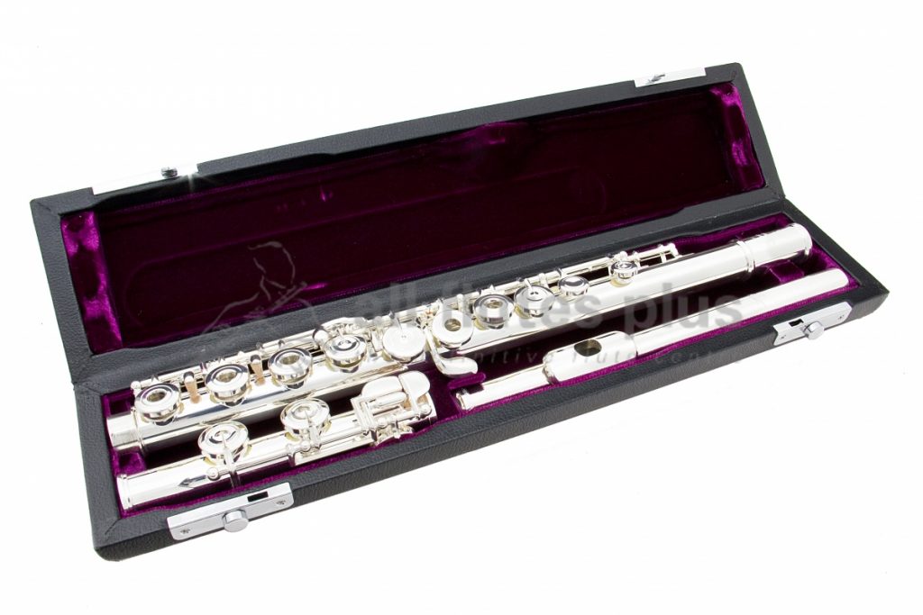 Trevor James Performers Virtuoso flute displayed in its open flute case with purple velvet interior